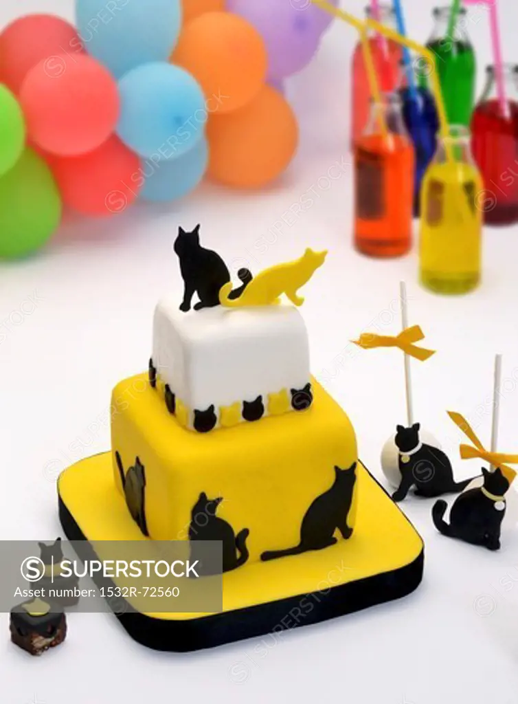 Tiered cake with a cat theme