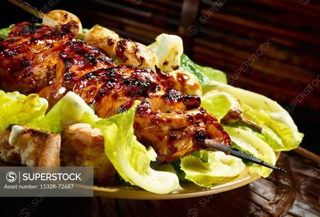 Grilled teriyaki chicken on Caesar salad