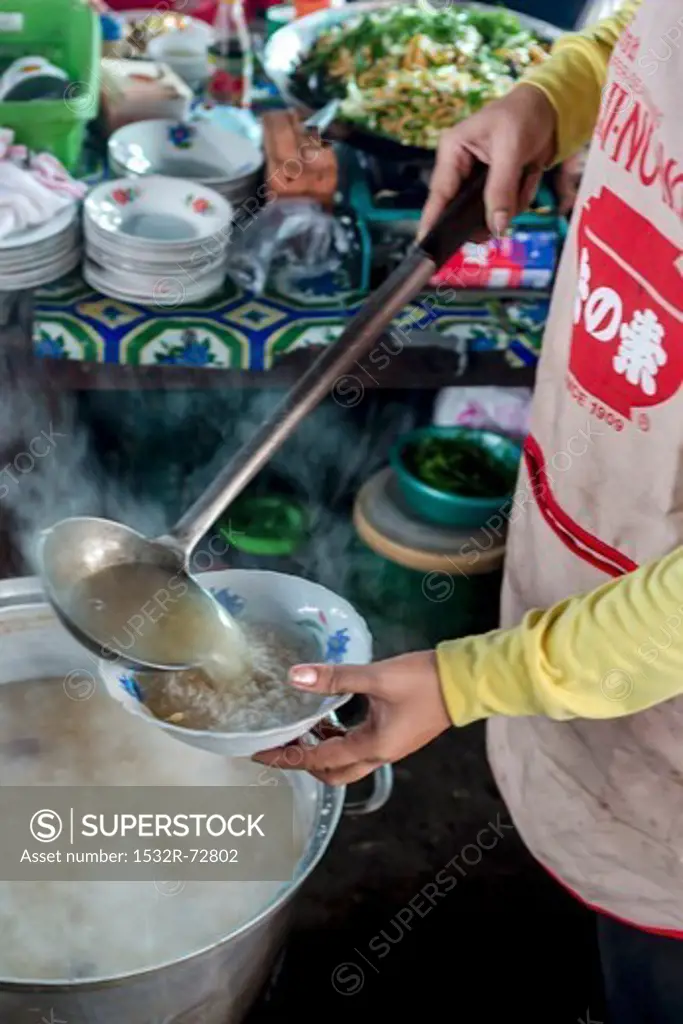 Rice soup is served in a street kitchen in Cambodia