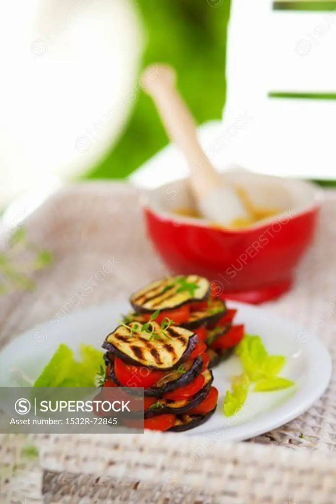 Vegetable stacks of grilled aubergine slices and tomatoes