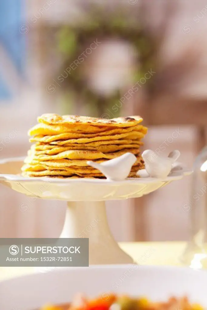 Pita breads on a cake stand