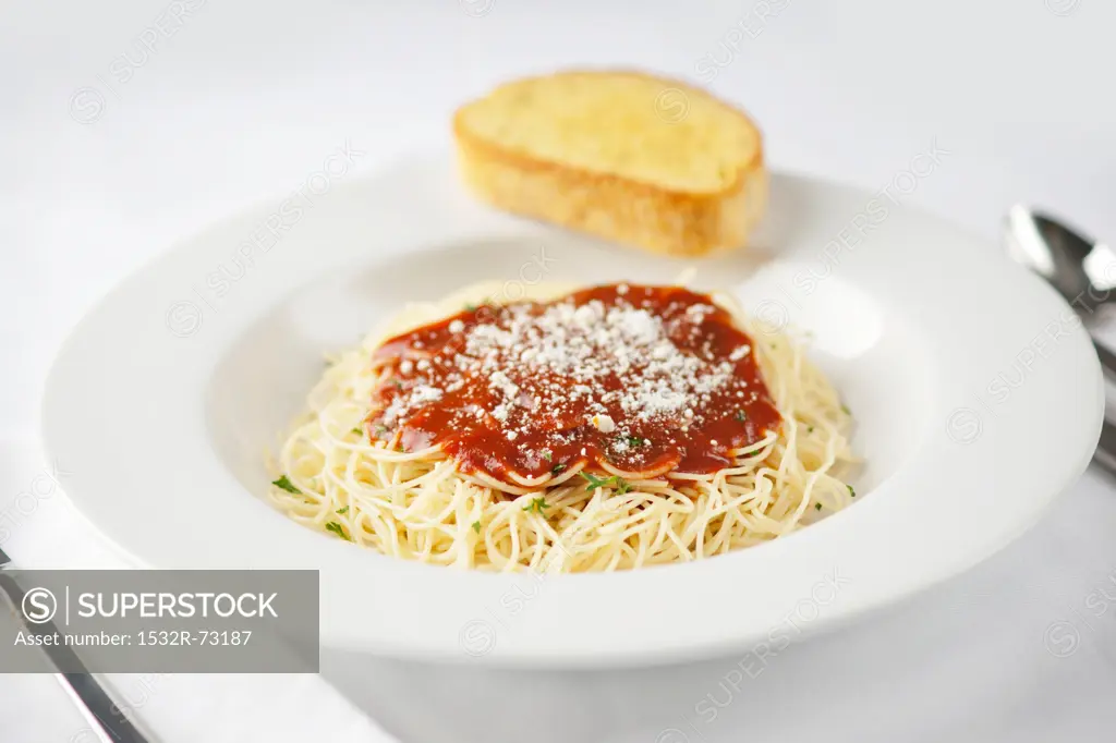 Spaghetti with Tomato Sauce in a White Bowl of with a Slice of Garlic Bread, 8/8/2013