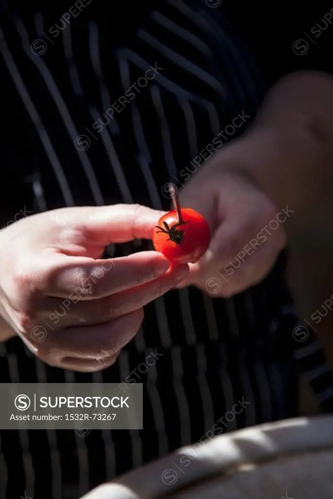 A tomato being skewered, 8/7/2013