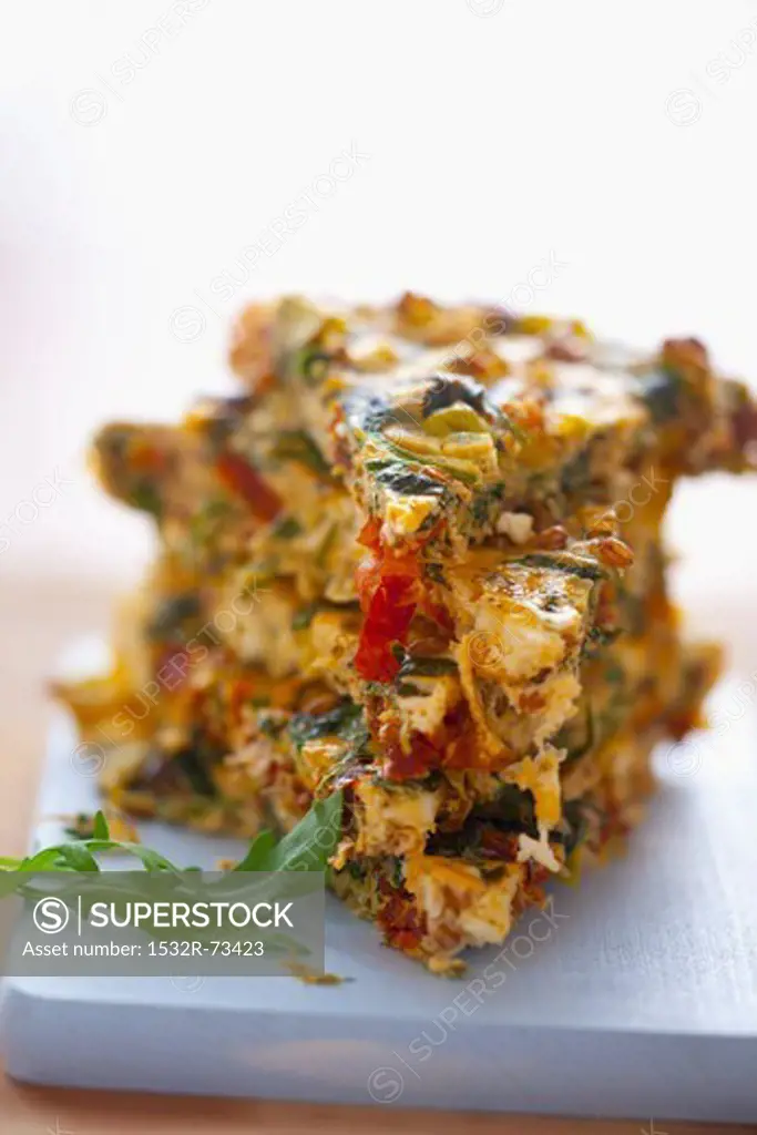 A portion of vegetable frittata with spinach, leek, sundried tomatoes and onions, 8/16/2013