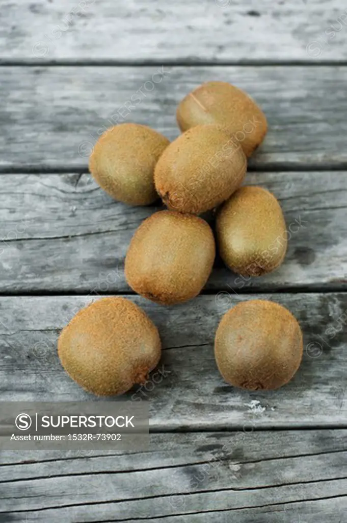 Several kiwi fruit on a wooden surface, 8/29/2013