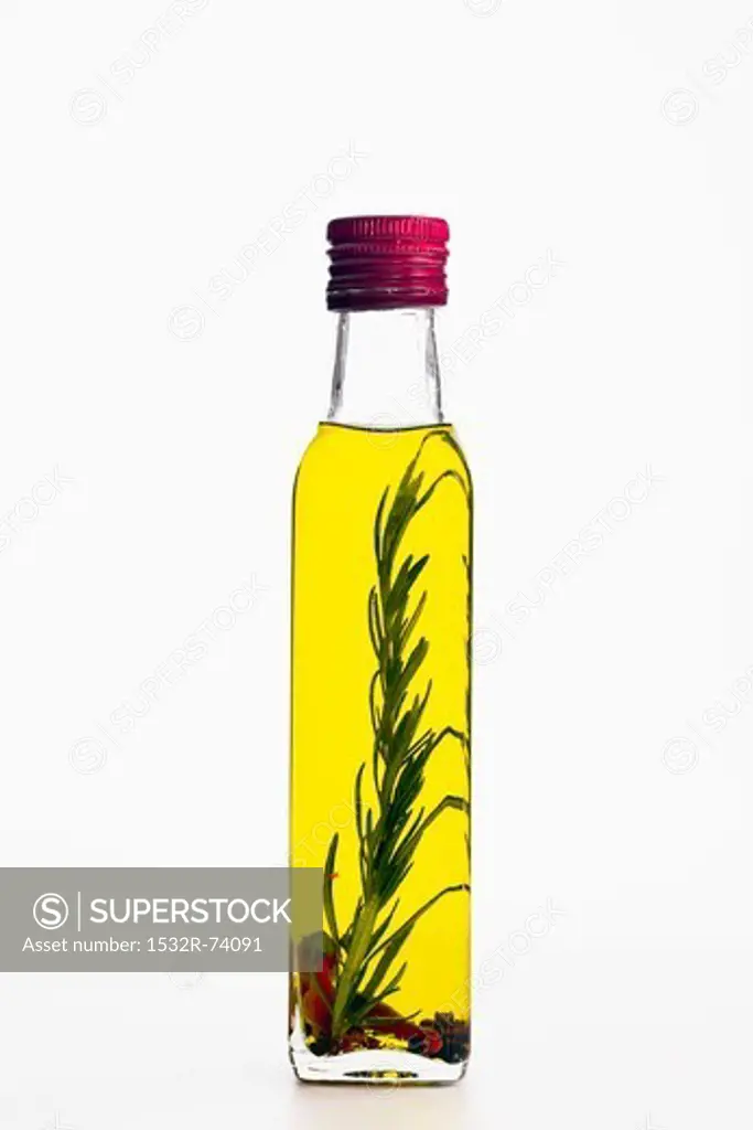Flavoured olive oil in a bottle with rosemary and chilli, 9/3/2013