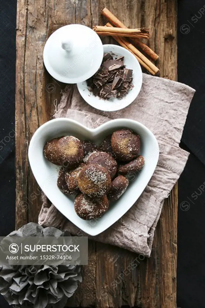Chocolate and cinnamon treats in a heart-shaped bowl, grated chocolate, cinnamon sticks, 9/6/2013