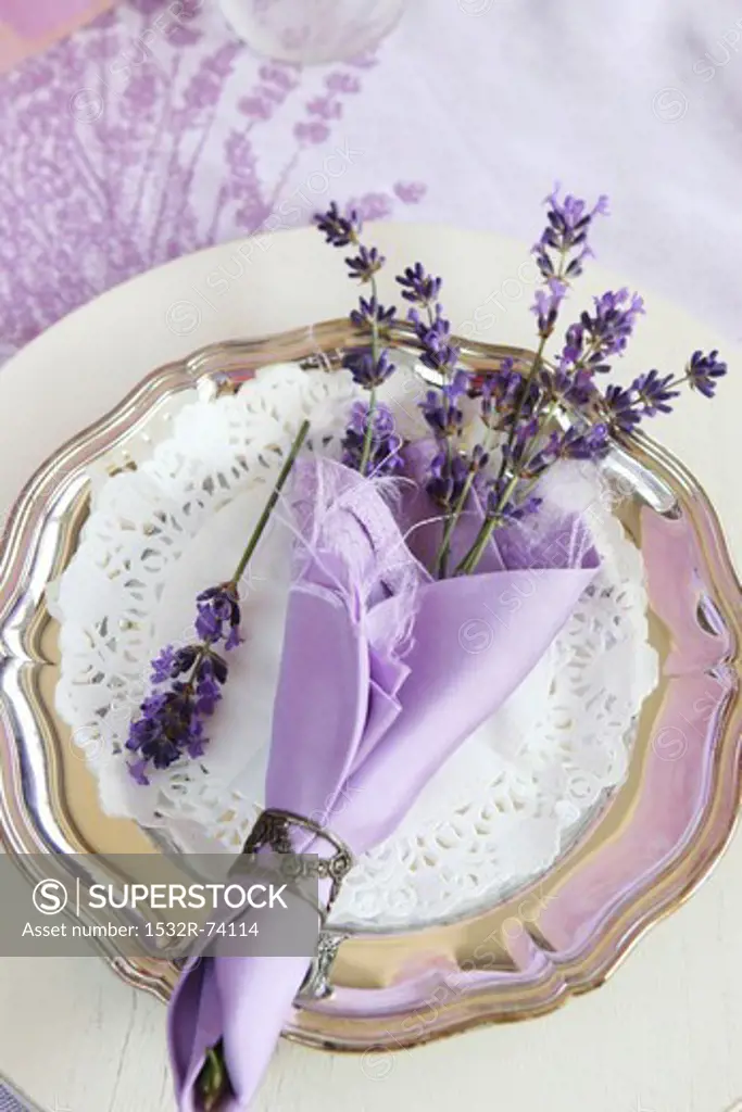 A table decoration for a celebration: lavender flowers in a purple napkin, 9/6/2013