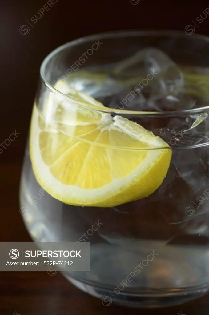 A glass of water with a wedge of lemon and ice cubes, 9/5/2013