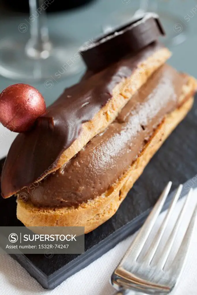 An éclair filled with chocolate cream and topped with chocolate decorations, 9/5/2013