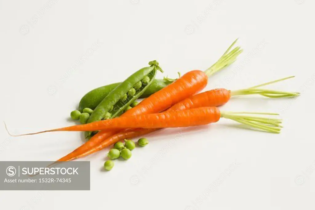 Fresh Peas and Carrots on a White Background, 9/9/2013