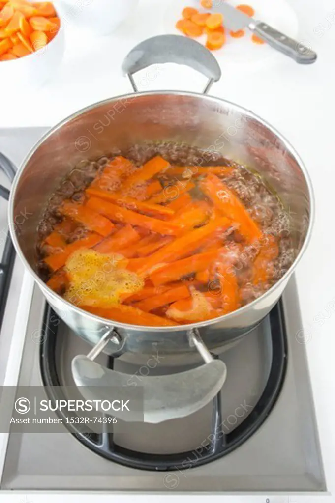 Carrots boiling on a gas hob, 9/9/2013
