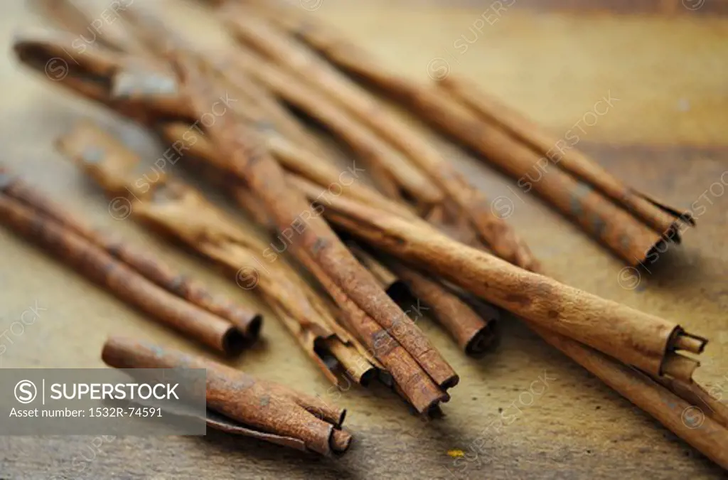 Several cinnamon sticks on a wooden board, 9/12/2013