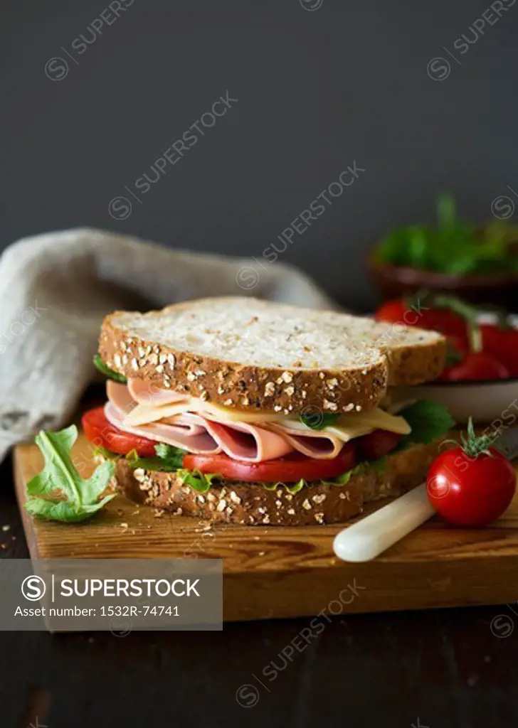 A sandwich filled with ham, cheese and lettuce, 9/16/2013