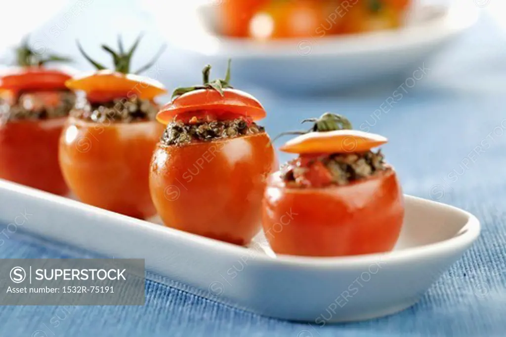 Detail of cherry tomatoes stuffed piquillo tapenade *** Local Caption *** Detalle de tomates cherry rellenos de tapenade de piquillos, 9/26/2013