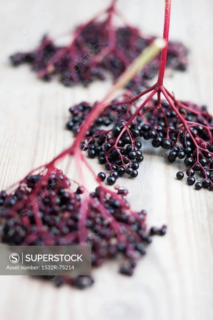 Elderberries on a wooden surface (close-up), 10/1/2013