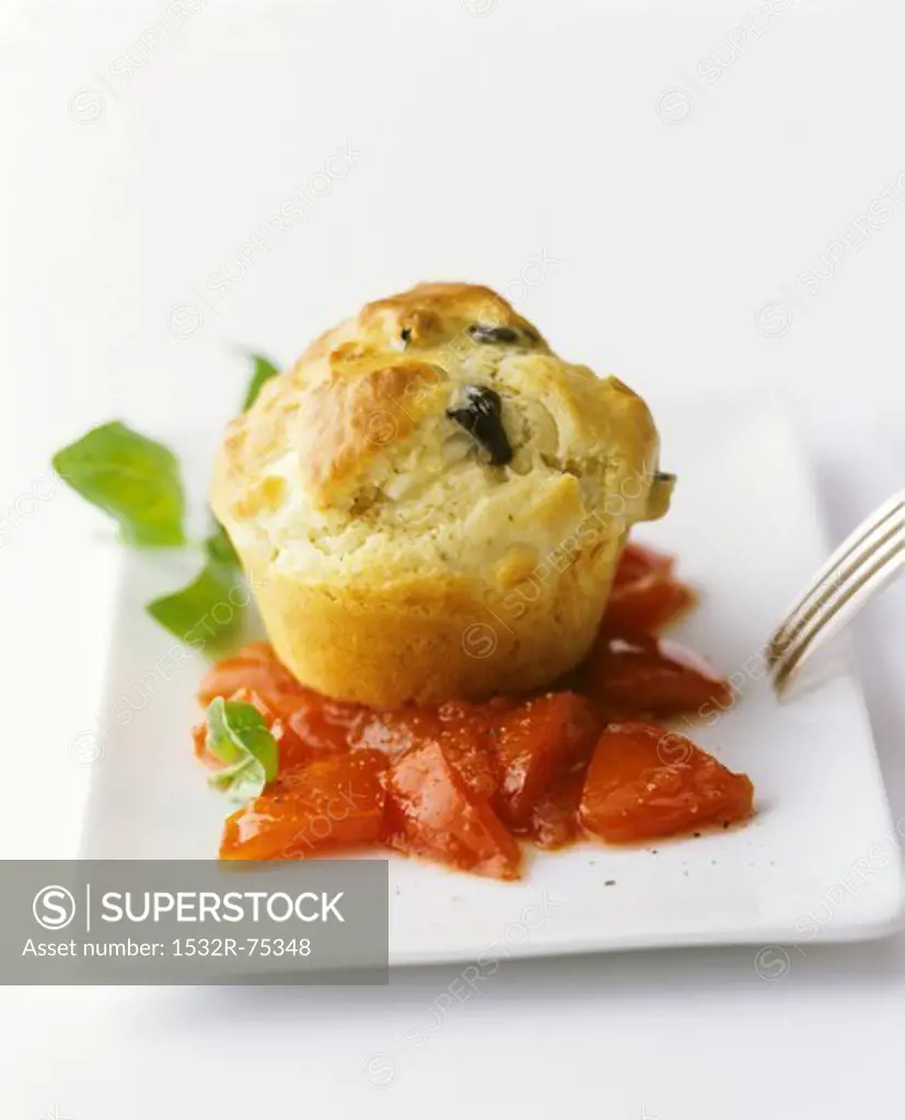 An olive muffin on tomatoes with basil, 9/28/2013