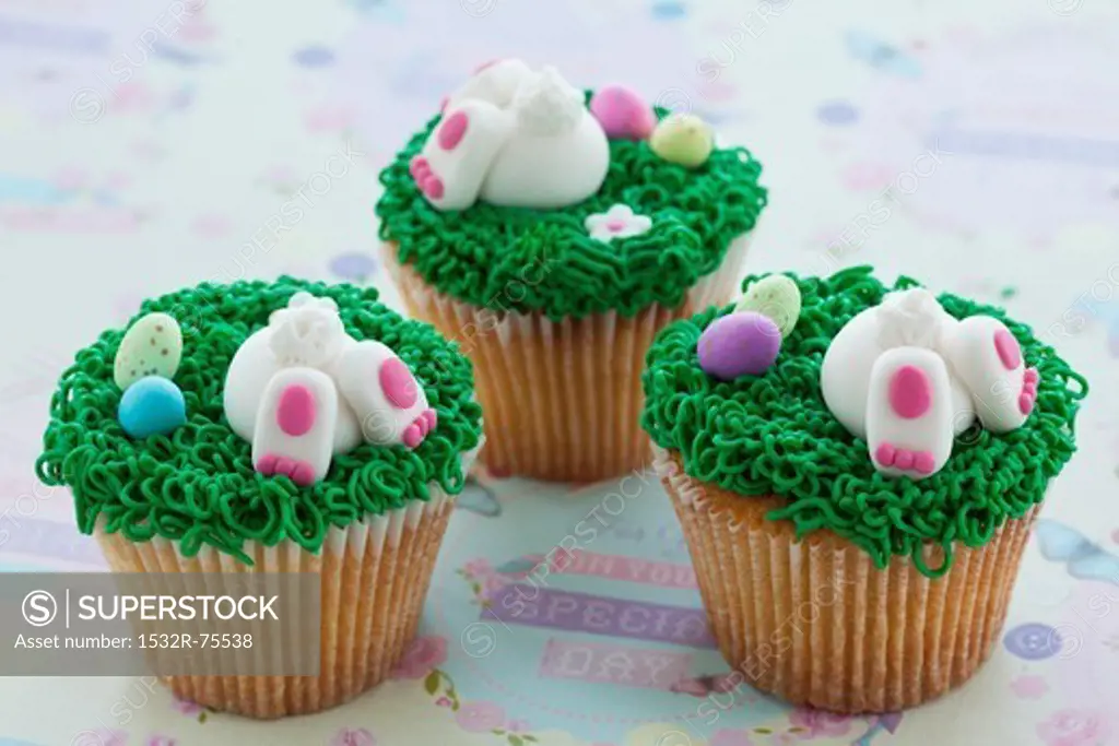 Vanilla cupcakes with buttercream and sweet Easter-themed decorations, 10/16/2013