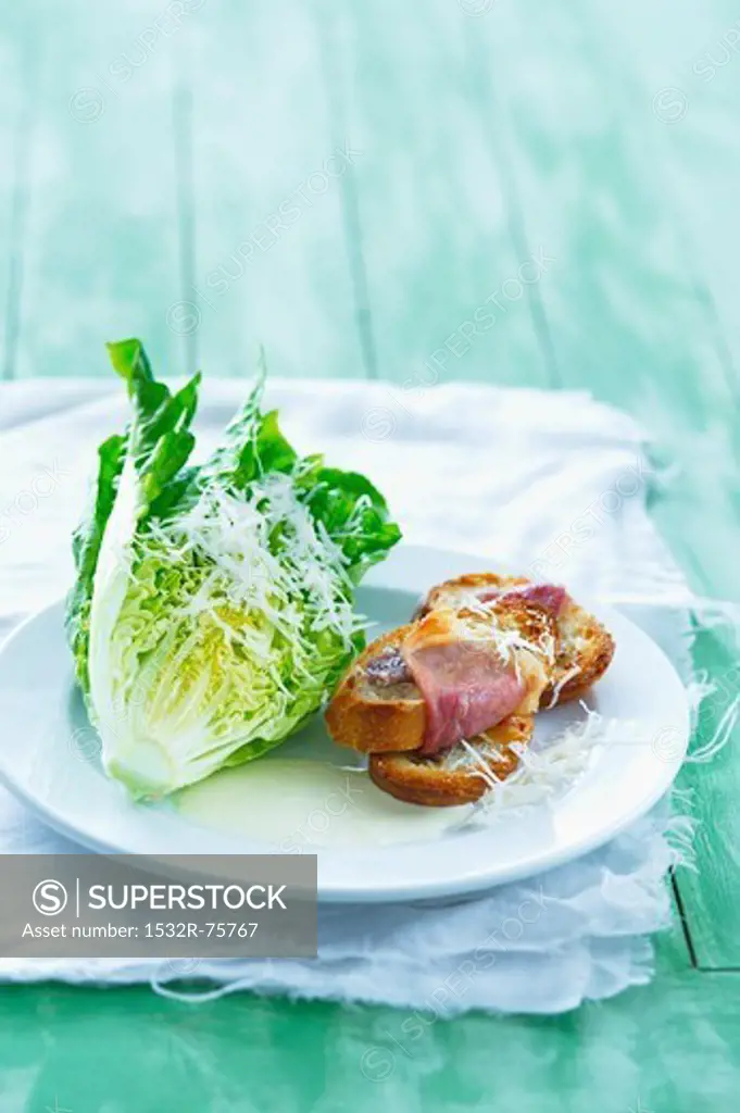 Lettuce with grated cheese, a yoghurt dressing and toasted baguette topped with bacon, 11/1/2013