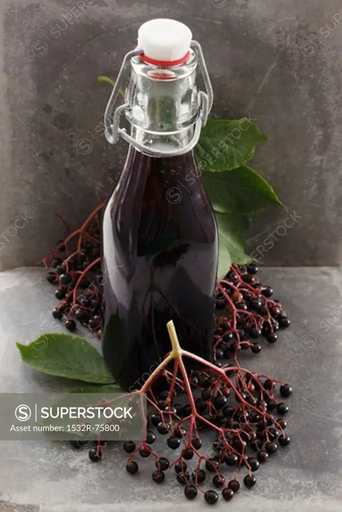A bottle of elderberry juice and fresh elderberries, 10/23/2013