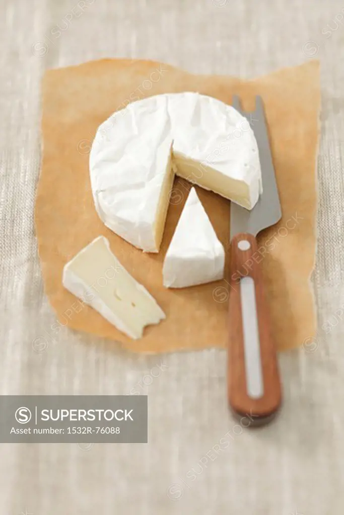 Camembert on grease-proof paper, partly sliced, 10/28/2013