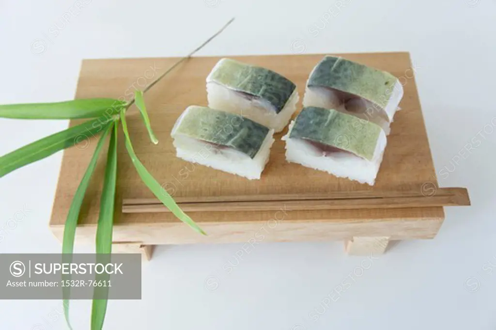 Oshi sushi with mackerel on a wooden slab, 11/16/2013