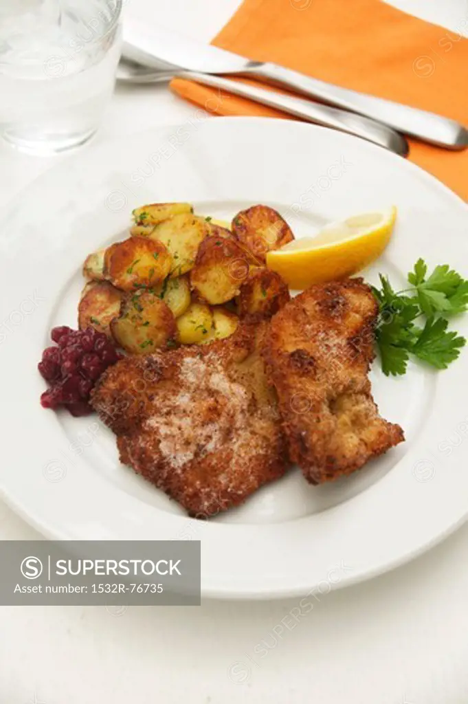 Wiener Schnitzel (breaded veal escalope from Vienna) with roast potatoes, cranberries and lemon, 11/20/2013