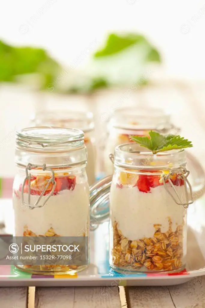 Muesli with oats, yoghurt, strawberries and flaked almonds, in jars, 11/29/2013