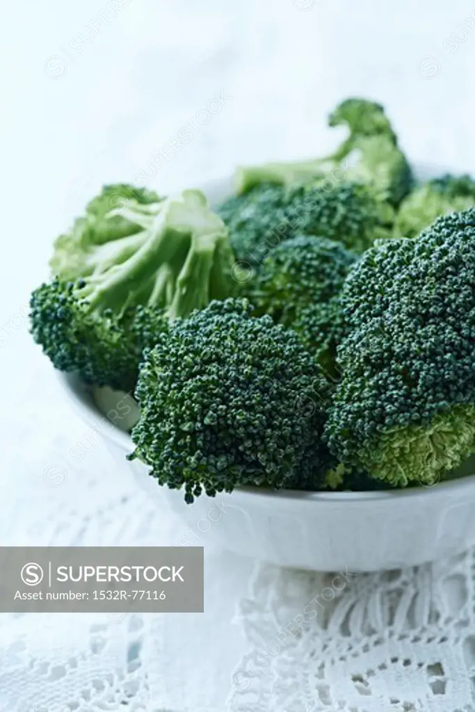 fresh broccoli in a white bowl; close up, 12/2/2013