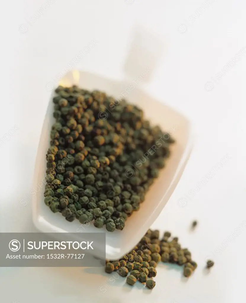 Black pepper corns in a plastic scoop, 12/4/2013