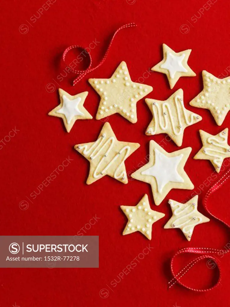 Star cookies for Christmas in front of a red background, 12/9/2013
