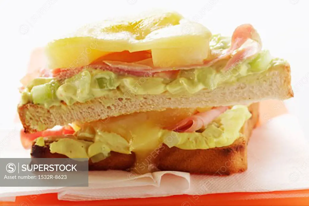 Ham and cheese on toast with pineapple and avocado cream