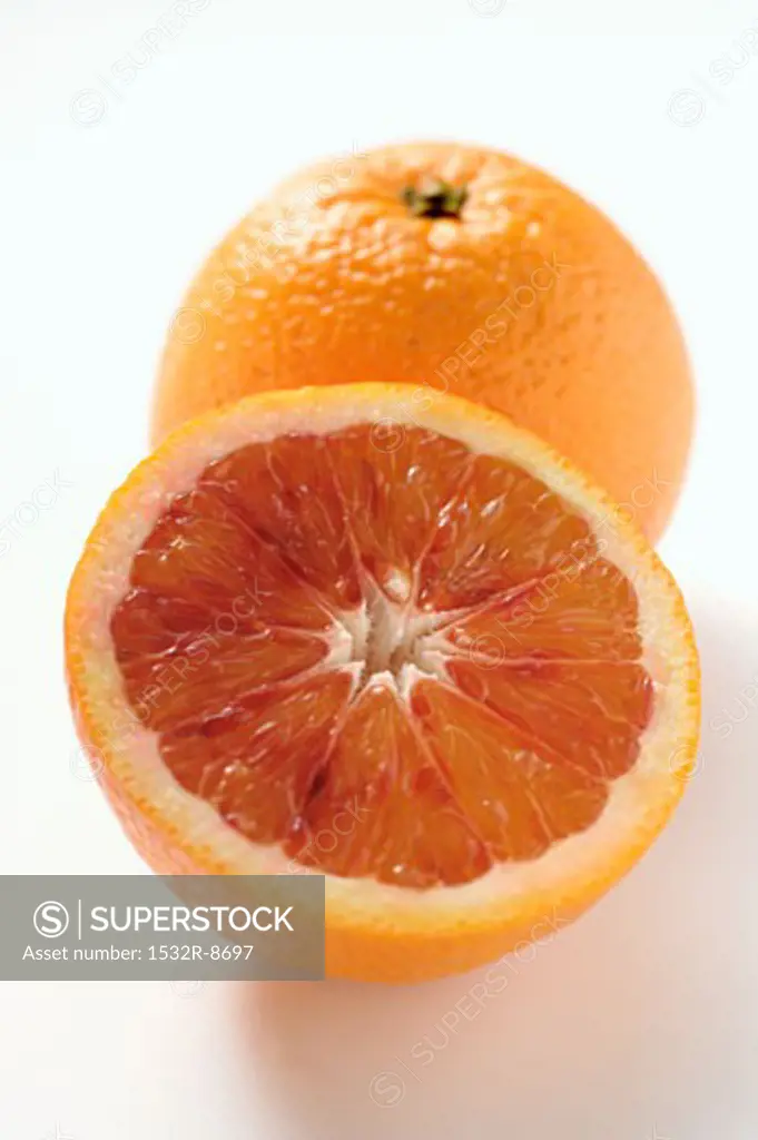 A whole and a half of a blood orange