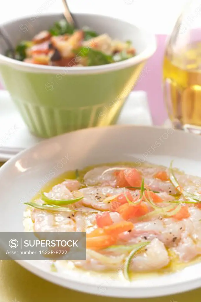 Carpaccio of raw shrimps, tomatoes and Green onions