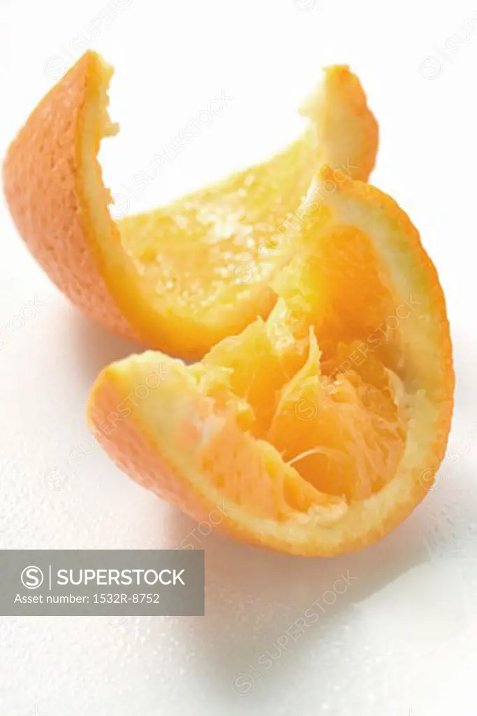 Squeezed wedge of orange and orange peel