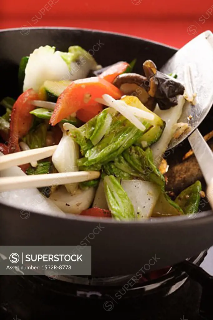 Asian vegetables with mushrooms in wok