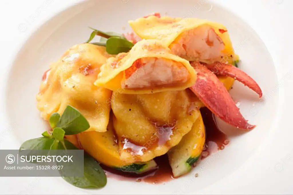 Ravioli with lobster filling on courgettes