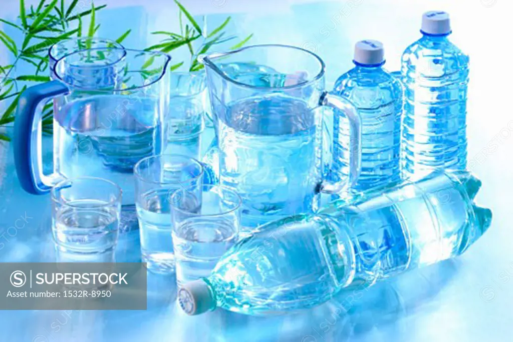 Water in glasses, jugs and plastic bottles
