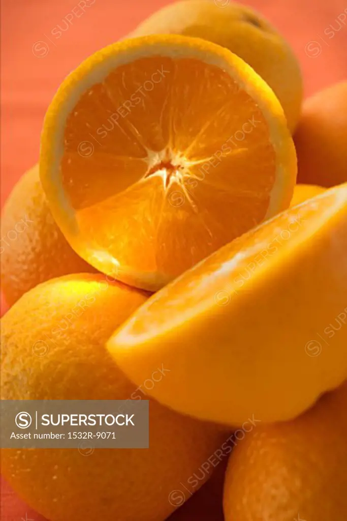 Whole and half oranges