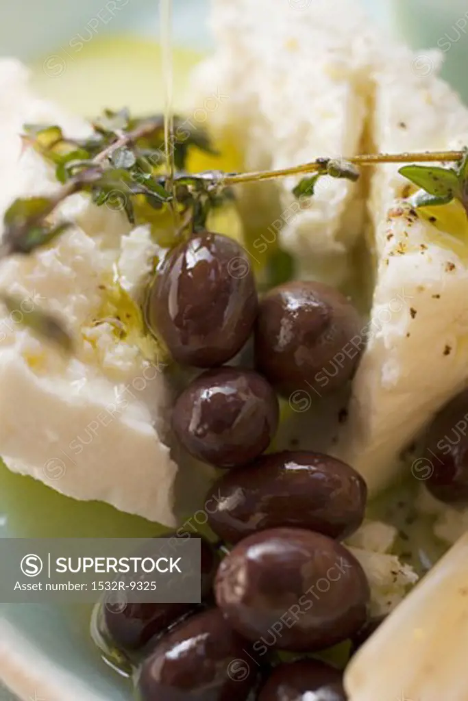 Feta cheese with olives, olive oil and thyme