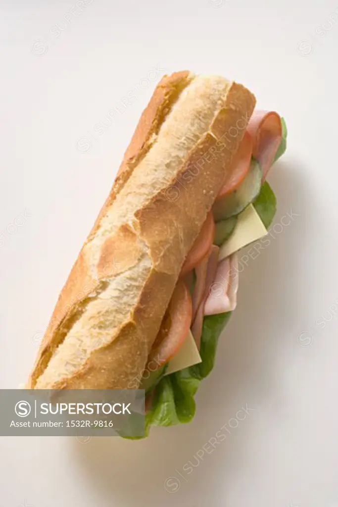 Baguette with ham, cheese, tomato, cucumber and lettuce