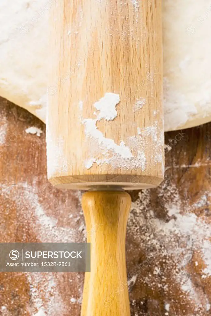 Dough with rolling pin (close-up)