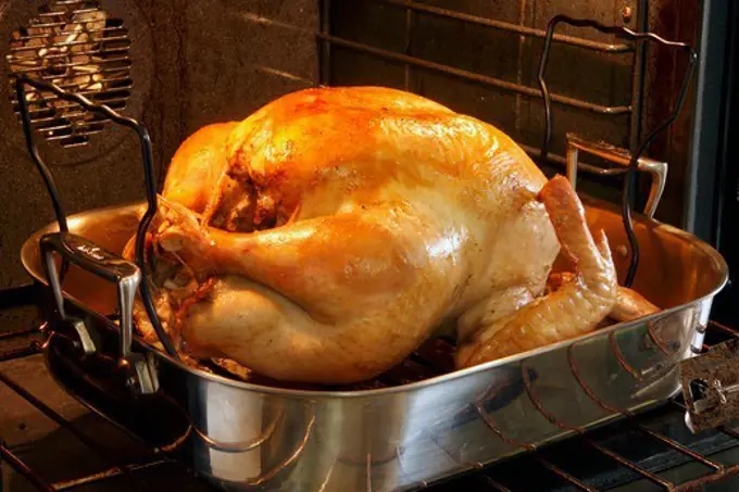 Whole Turkey in a Roasting Pan in the Oven
