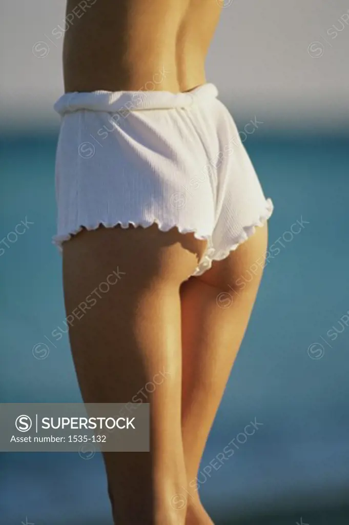 Mid section view of a woman wearing shorts