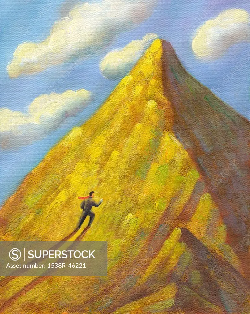 A businessman climbing a mountain