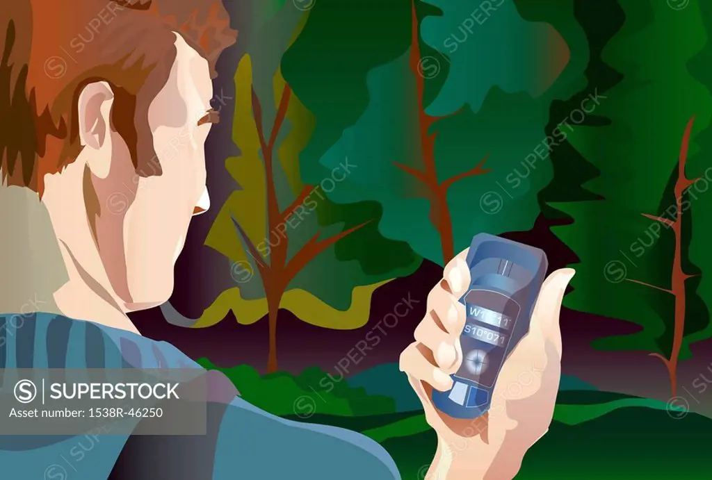 A man using a cell phone in a forest