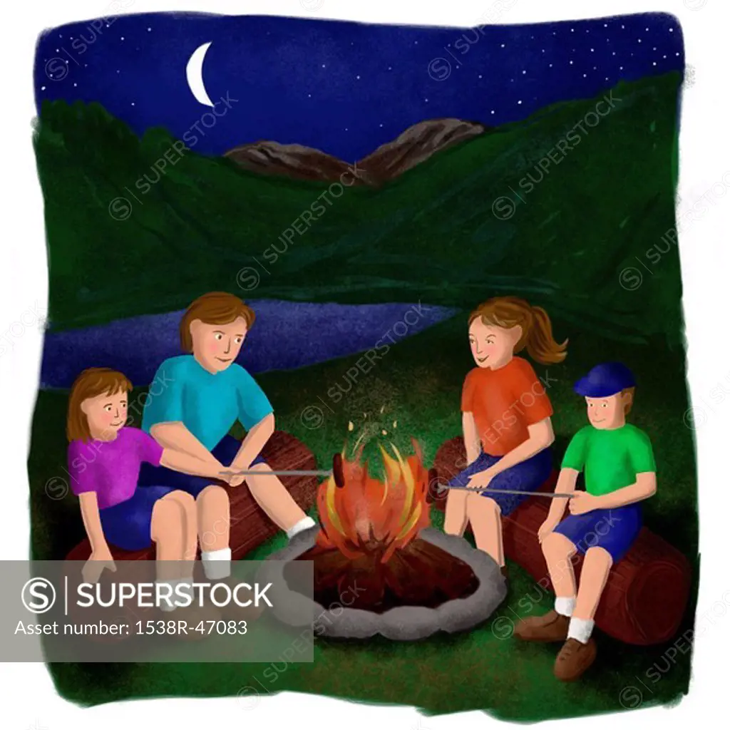 A family cooking sausages by the campfire at night