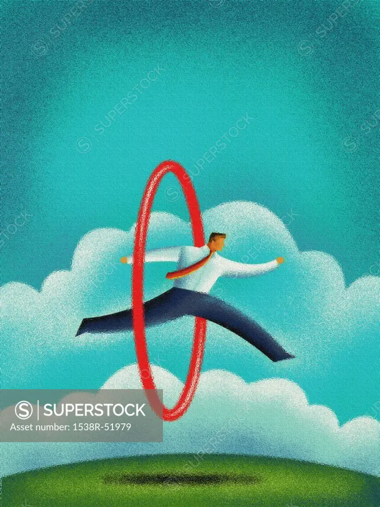 A business man jumping through a hula hoop