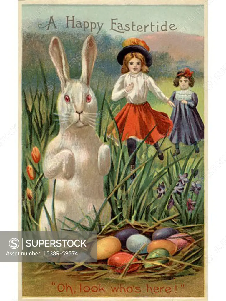 A vintage Easter postcard of two girls running towards a rabbit and a nest of colored eggs