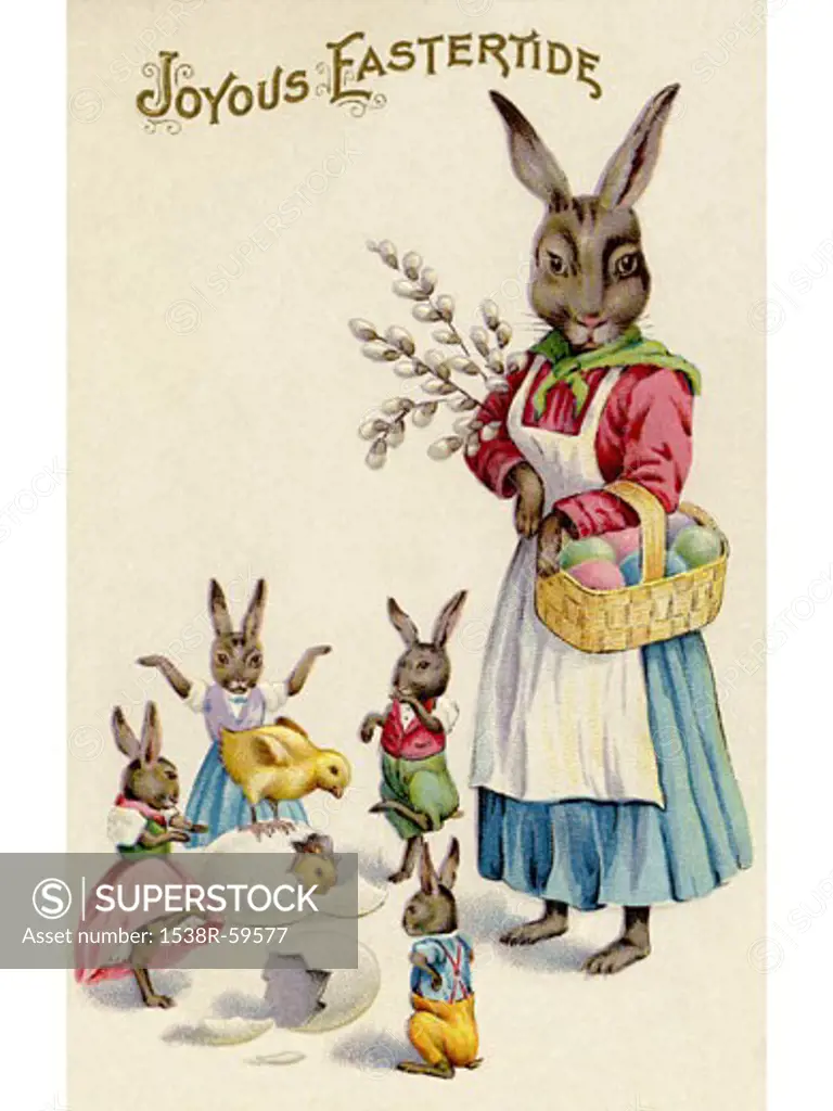 A vintage Easter postcard of a rabbit and her rabbit children playing around hatching eggs